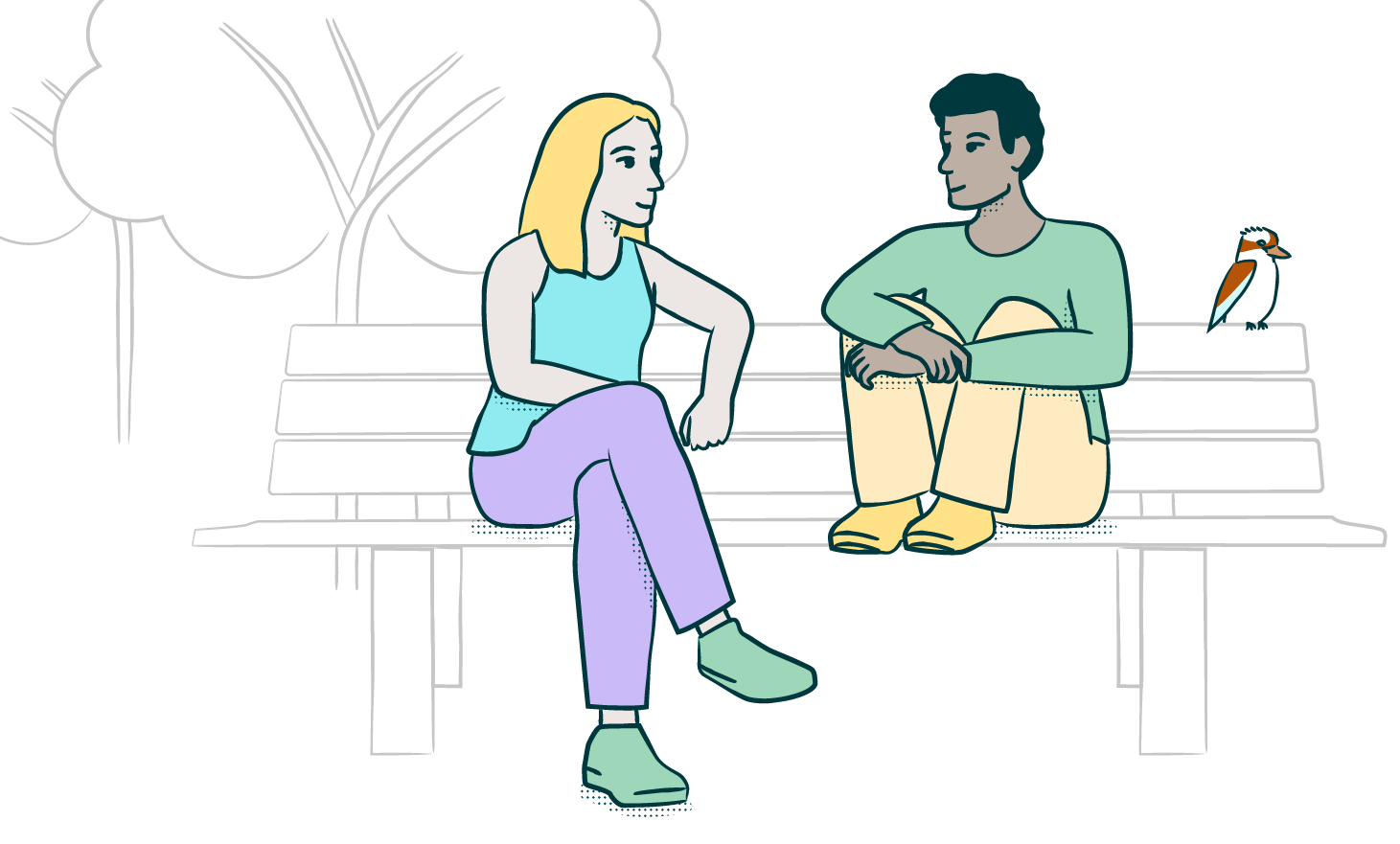 Two people sitting on a park bench chatting